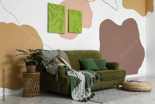 Comfortable sofa, pouf with...