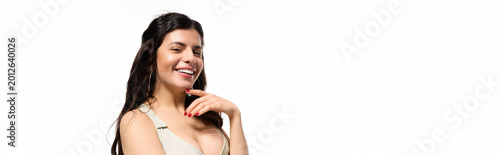 Photography Stylish young woman in a trendy summer dress enjoys a sunny moment in the studio