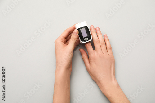 Female hands with pulse oxi...