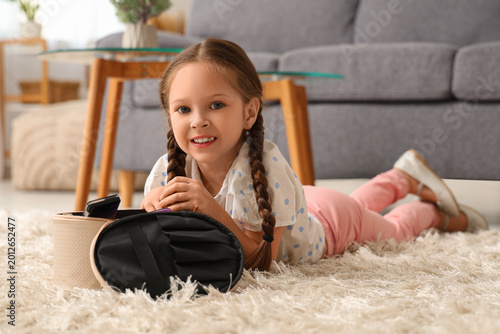 Cute little girl with cosme...