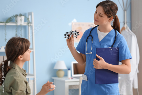 Female ophthalmologist with...