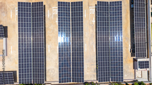 Εκτύπωση καμβά Aerial view of solar panels covering a parking lot, generating sustainable power