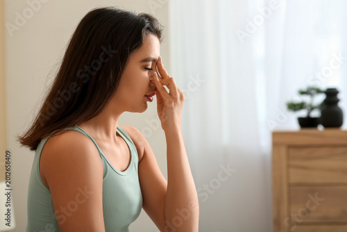 Young woman doing breathing...
