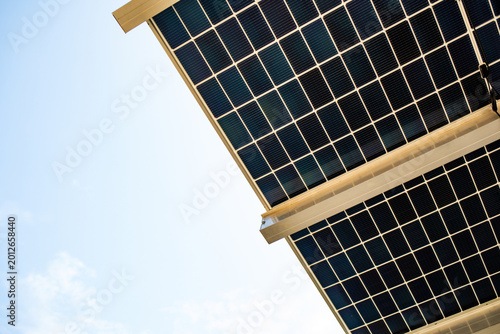 Bilde på lerret Solar panels absorbing sunlight, generating clean renewable energy against a cle