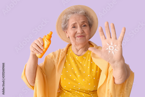 Senior woman with sun made ...