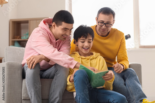 Happy little boy with his d...