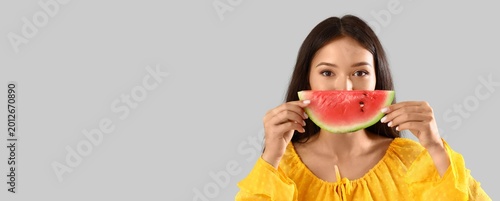 Young Asian woman with slic...