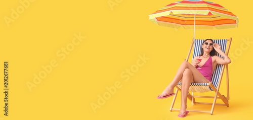 Young woman with beach umbr...