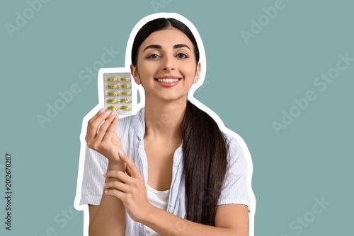 Young woman with vitamin E ...