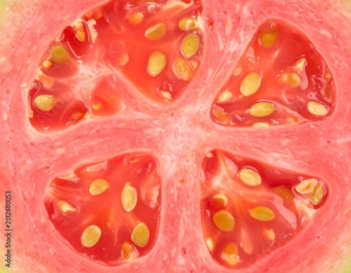 A cross-section of a vibrant pink fruit