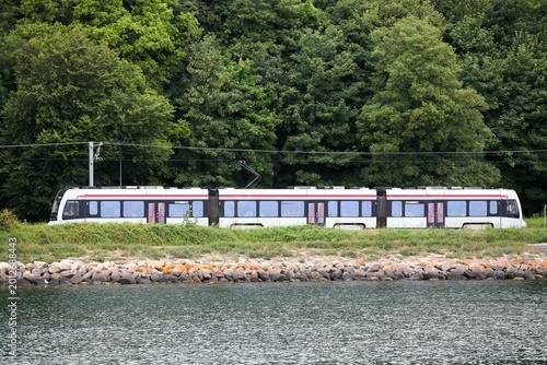 The letbane traveling along the seaside towards Risskov forest in Aarhus, Denmark