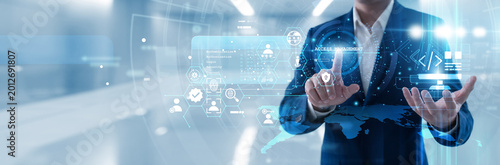 Photos Security admin hand touching access management panel to regulate user permissions, verify identities and protect sensitive data across the cloud while maintaining high safety standards