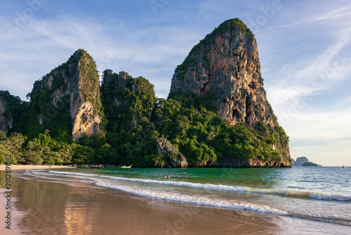 Spectacular golden sunset over the limestone cliffs of Railay West Beach in Krabi, Thailand