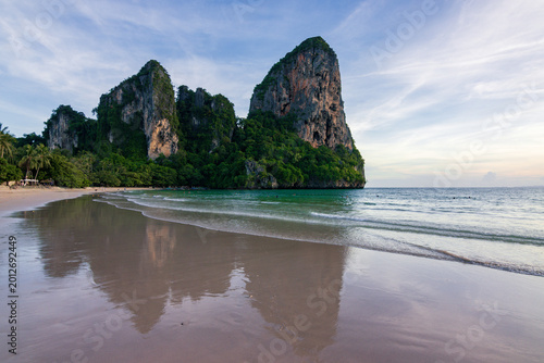 Spectacular golden sunset over the limestone cliffs of Railay West Beach in Krabi, Thailand