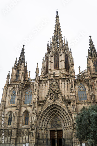 Slika na platnu Front facade of Barcelona Cathedral in Spain with towering Gothic spires and det