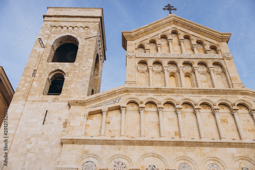 Fototapeta premium Cagliari Cathedral facade, bell tower, and entrance in Sardinia, Italy, displaying intricate Romanesque architectural details
