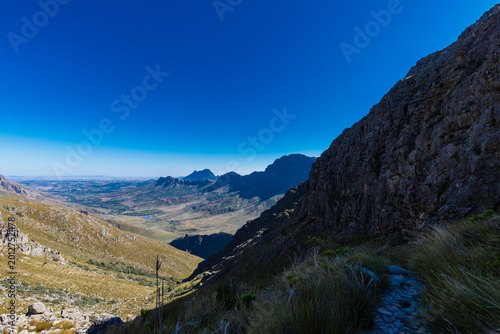 An amazing view on a perfect day over the Jonkershoek Nature Reserve located close to Stellenbosch in South Africa and home to the Jonkershoek Mountains and the impressiv valley. The reserve includes 