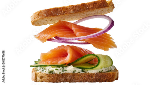 Quadro su tela Smoked salmon sandwich with cream cheese cucumber red onion, isolated on transpa