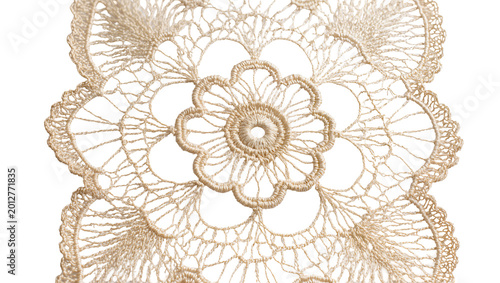Obraz na płótnie Delicate beige crocheted lace doily with intricate floral pattern, isolated on t