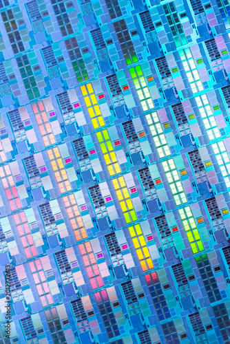 High-tech Macro Photography of a Colorful Silicon Wafer with Microchip Patterns for AI Hardware and Semiconductor Industry Concept.