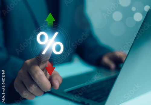 Businessman analyzing percentage rate increase and decrease on digital interface, financial interest, investment growth, inflation, tax and economic business technology concept