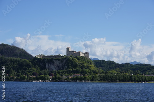 Tableau sur toile View of the historic Rocca di Angera fortress rising above the shores of Lake Maggiore in Lombardy, Italy