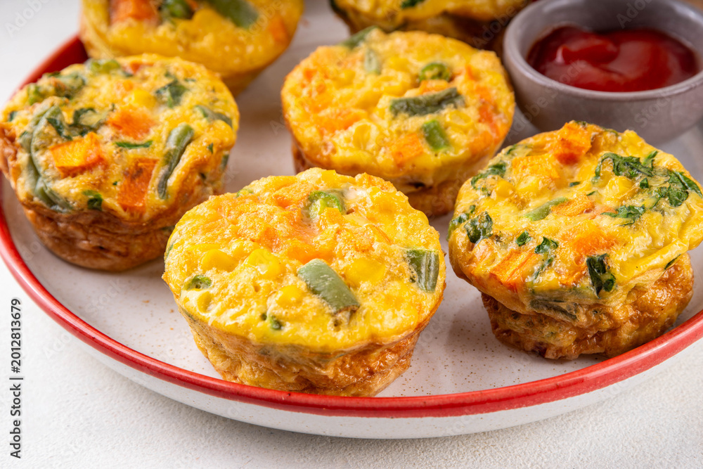 Fototapeta premium Loaded egg bites with spring vegetables