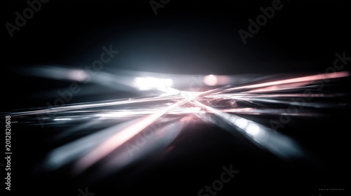 Abstract Creative Composition Featuring Light Reflections, Shimmering Lines, and Dynamic Patterns on a Dark Background, Evoking a Sense of Depth and Motion