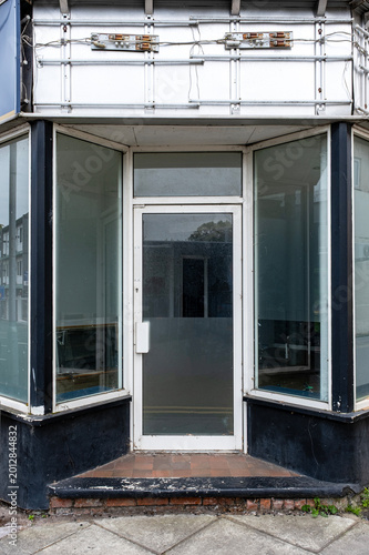 Closed down shop with removed shop sign
