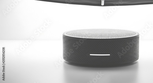 Blue and yellow striped wireless speaker on white background