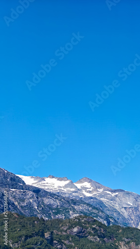Photography Glacier Bay, Alaska - USA - August 4, 2024 - Alaska Mountain Range Clear Blue Sk