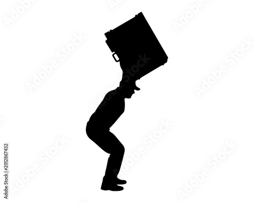 Cuadro en lienzo Silhouette of a man carrying a heavy box on his shoulder
