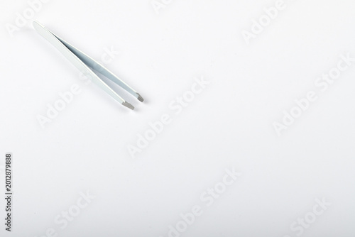 Close up view of tweezers isolated on white background