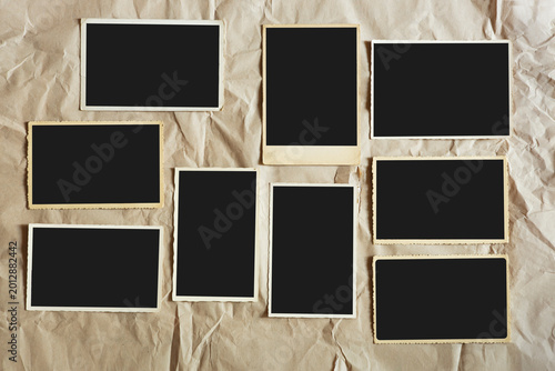 Obraz na plátne old empty photo frames, vintage blank photographic prints on wood with free spac