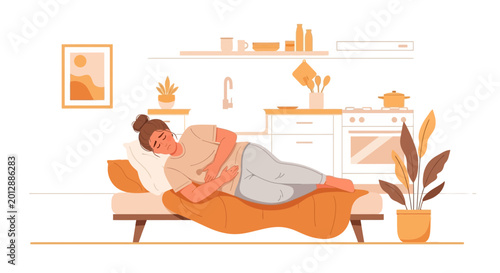 Woman Experiencing Stomach Pain Resting On A Couch In A Modern Kitchen