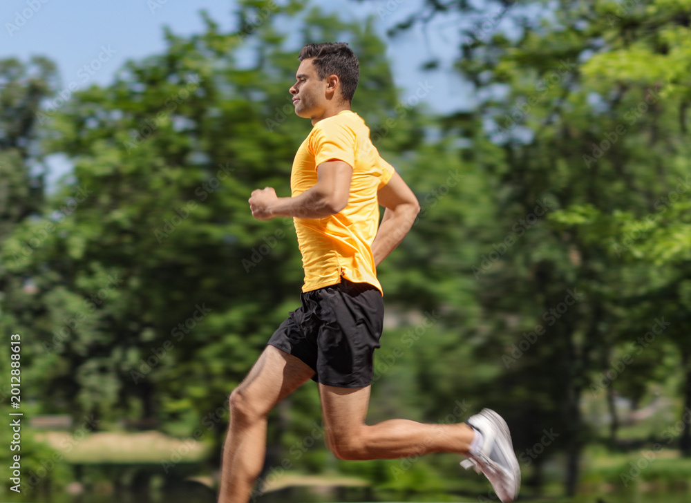 Fototapeta premium Profile shot of a guy running