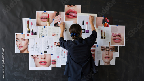 Woman arranging lipstick samples on a mood board