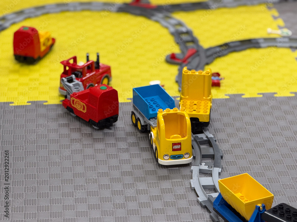 Fototapeta premium Colorful toy train on foam play mats