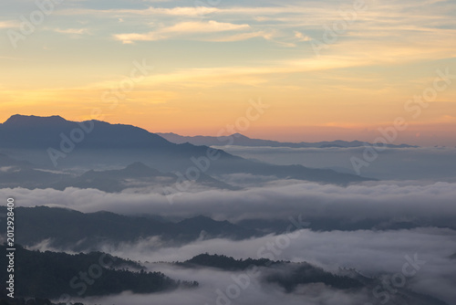 Misty Mountain Range at Sunrise