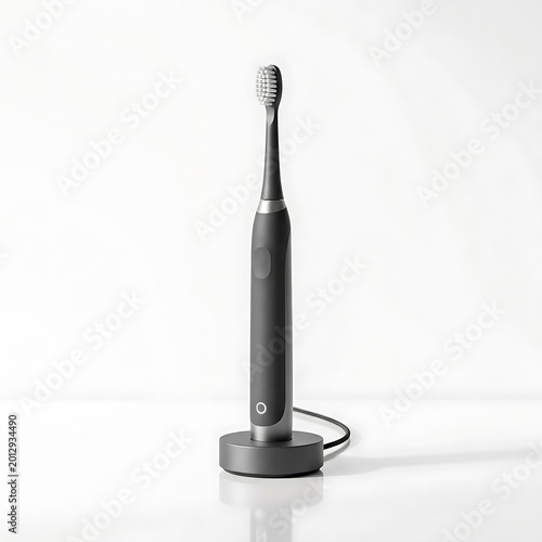 Black electric toothbrush on charging dock