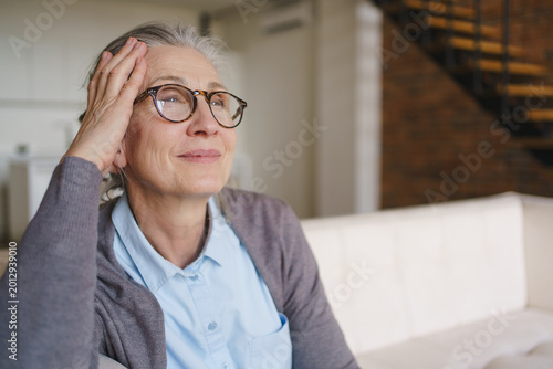 Tableau sur toile Happy senior woman portrait looking away with copy space, elderly lifestyle, pos