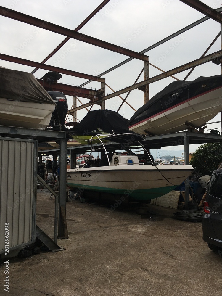 Fototapeta premium Boats Stored Under Metal Frame Structure