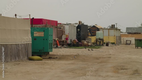 Food trucks at a beach with palm trees