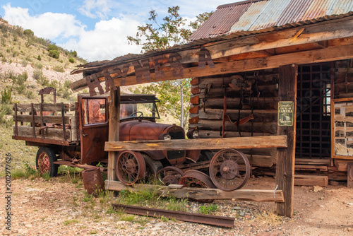 Ghost Town in Jeremy, Arizona with old cars, trucks and mining equipment and old buildings