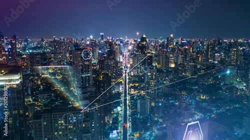 Futuristic Bangkok at night with digital overlay showing network connections, data transmission, and communication technology between illuminated city buildings