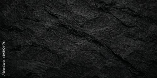 A dark grunge wall featuring a rough black stone surface and crumpled fabric textures creates a natural wood and paper material backdrop for a black and white pattern design