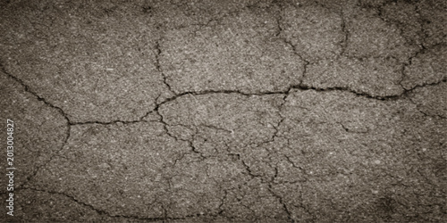 Schilderij op canvas An abstract pattern of dry cracked soil and rough brown earth reveals a textured