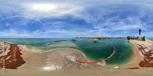 Dredging barge and jetty at the Hillsboro Inlet Florida aerial 360 VR 8k stock video 2026