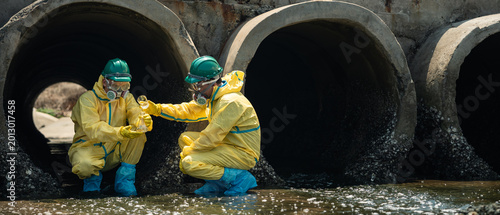Slika na platnu Environmental Workers Inspecting Polluted Wastewater Drainage Tunnel In Coastal
