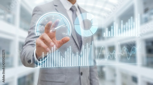 Businessman in suit interacting with futuristic holographic financial charts and graphs displaying data analysis and performance metrics 189 characters analytics finance digital